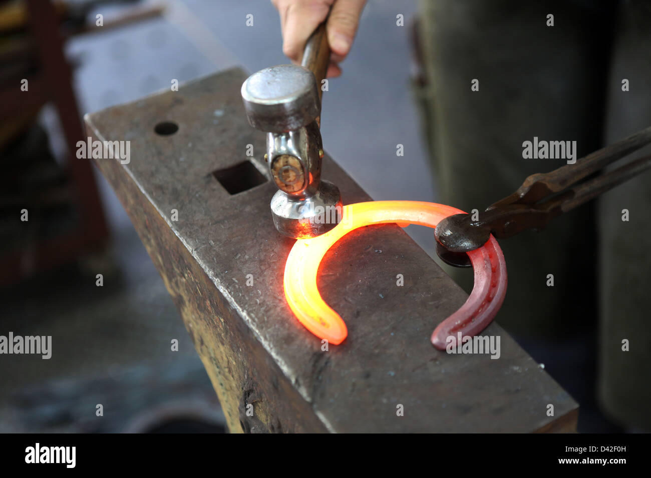 Sheung Shui, China, horseshoe is forged Stock Photo