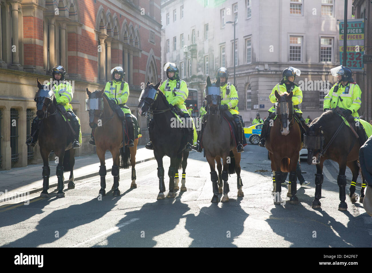 Manchester, UK. 2nd March 2013. Members of the far-right English Defence League (EDL) clash with police during a protest in Manchester. Approximately 300 members of the 'Islamophobic' group attended.Around Albert Square police had blocked off all the roads using horses and vans while the EDL members were protesting. Credit: Lydia Pagoni/Alamy Live News Stock Photo