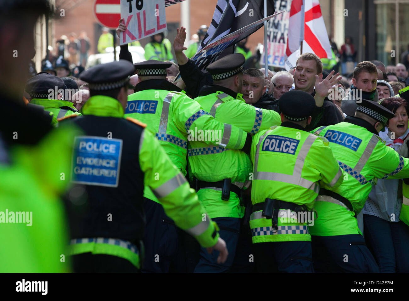 Manchester, UK. 2nd March 2013. Members of the far-right English Defence League (EDL) clash with police during a protest in Manchester. Approximately 300 members of the 'Islamophobic' group attended. members of the EDL tried to break the police lines while marching towards Albert Square. Credit: Lydia Pagoni/Alamy Live News Stock Photo