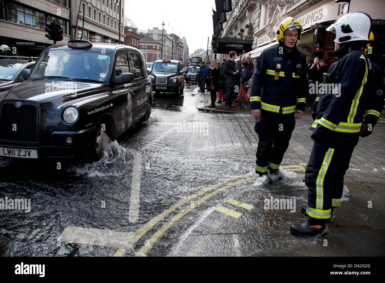 London, UK. Saturday 2nd March 2013. Burst water main causes flooding disruption in central London. Emergency services on hand at the scene. Stock Photo