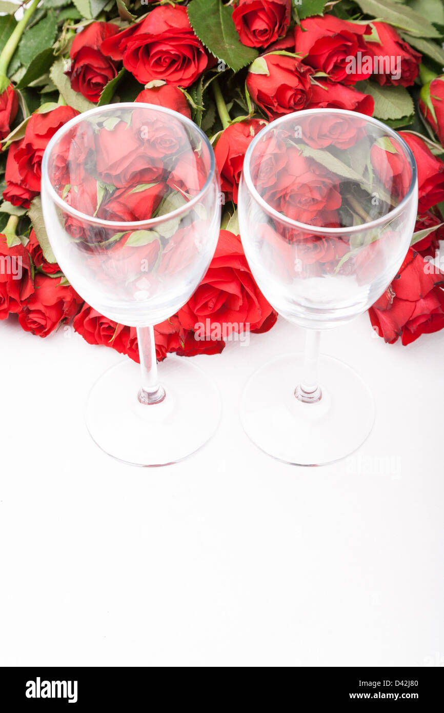 background with red roses and wine glass on white Stock Photo - Alamy