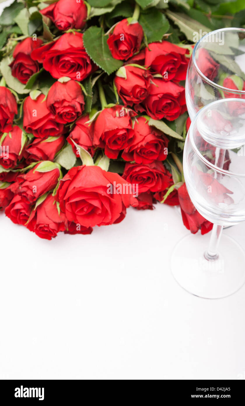 background with red roses and wine glass on white Stock Photo - Alamy
