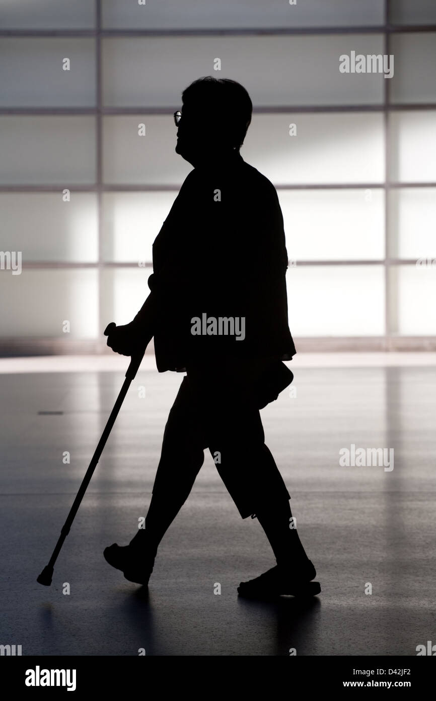 Berlin, Germany, the silhouette of a pensioner with a crutch Stock Photo