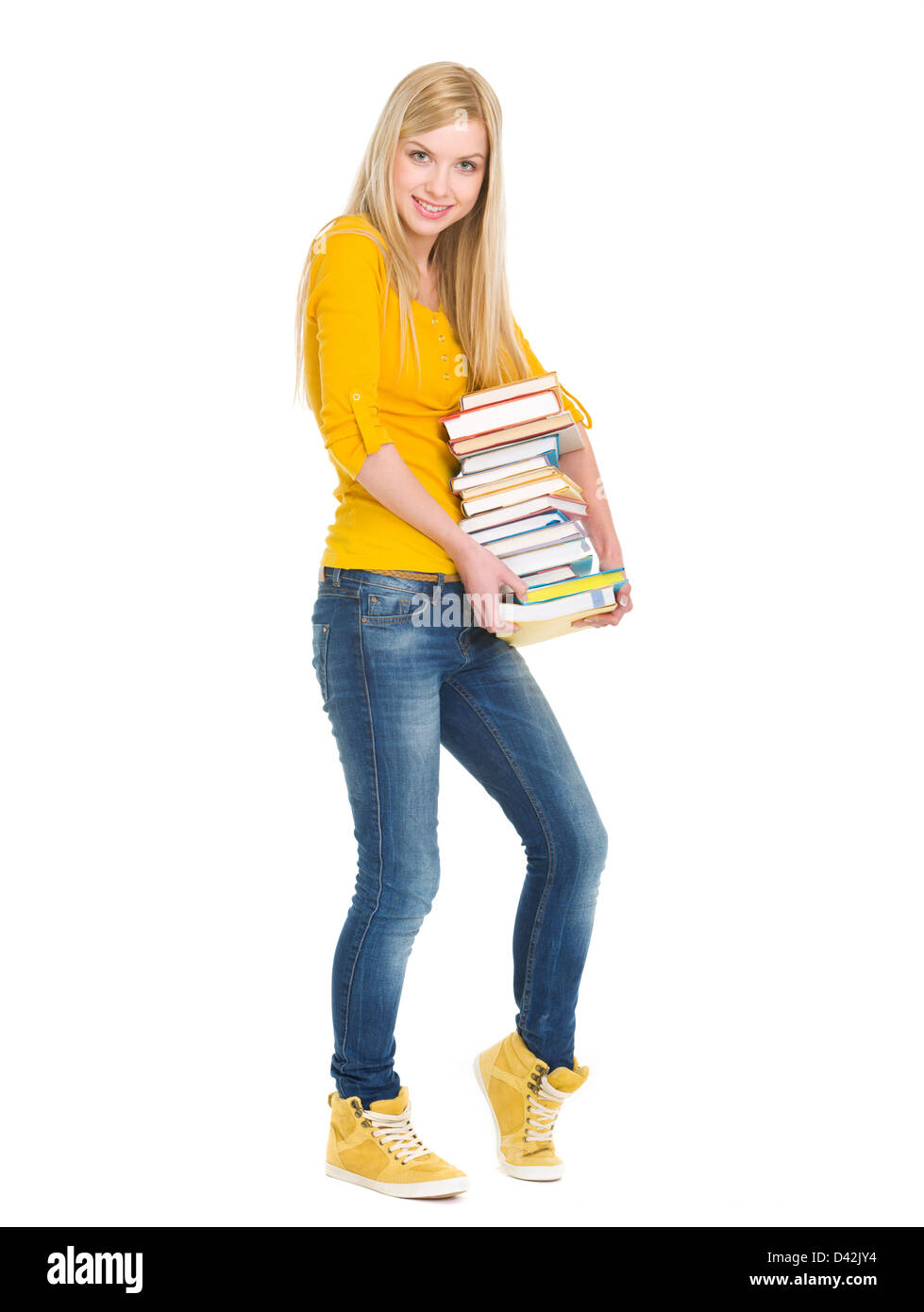 Full length portrait of happy student girl holding stack of books Stock ...