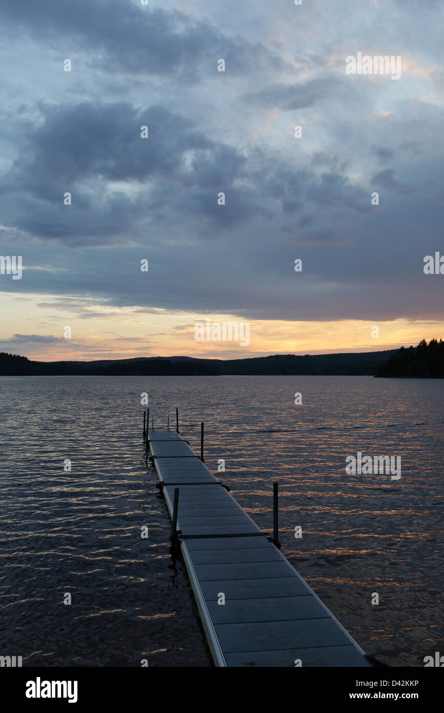 Storsa Lesjoen, Sweden, jetty and sunset on a lake Stock Photo