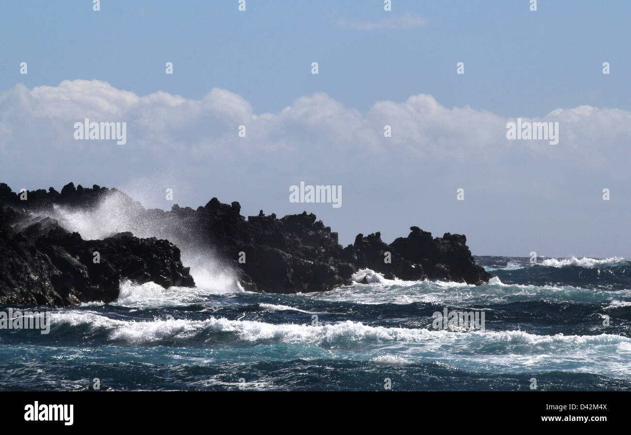 Ocean waves crashing on lava Hawaii the Big Island pacific ocean Stock Photo