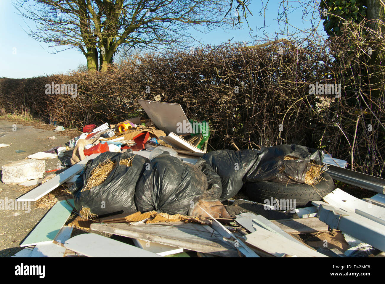 Fly tipped household rubbish in a green lane / bridleway, South Yorkshire, England. Stock Photo