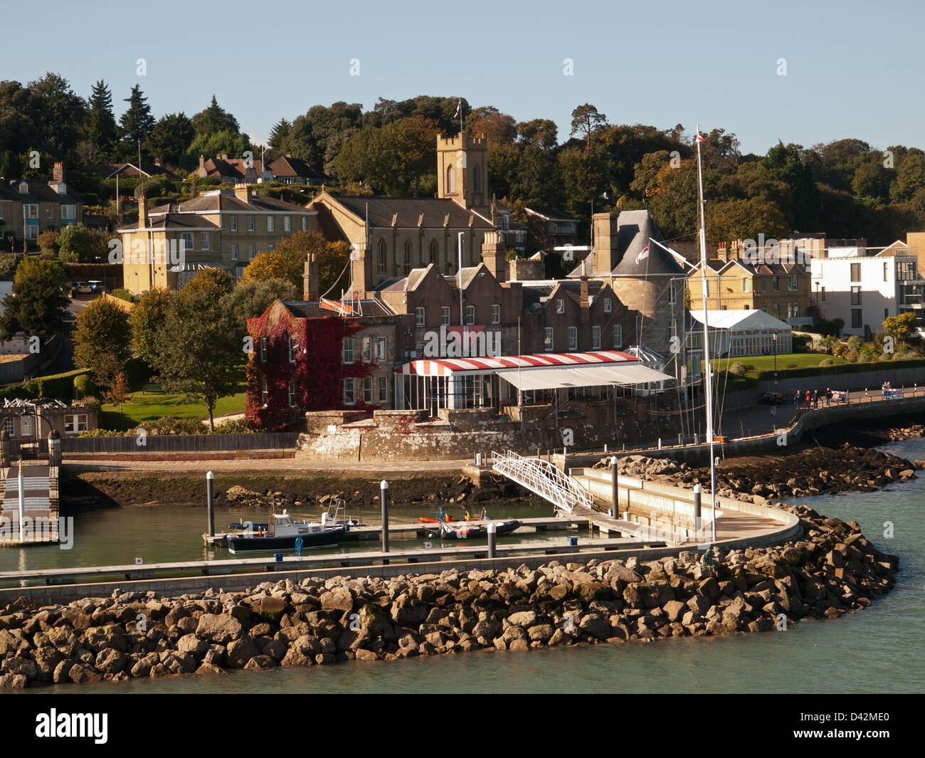 Royal Yacht Squadron West Cowes Isle of Wight England UK with Holy Trinity Parish Church in the background Stock Photo