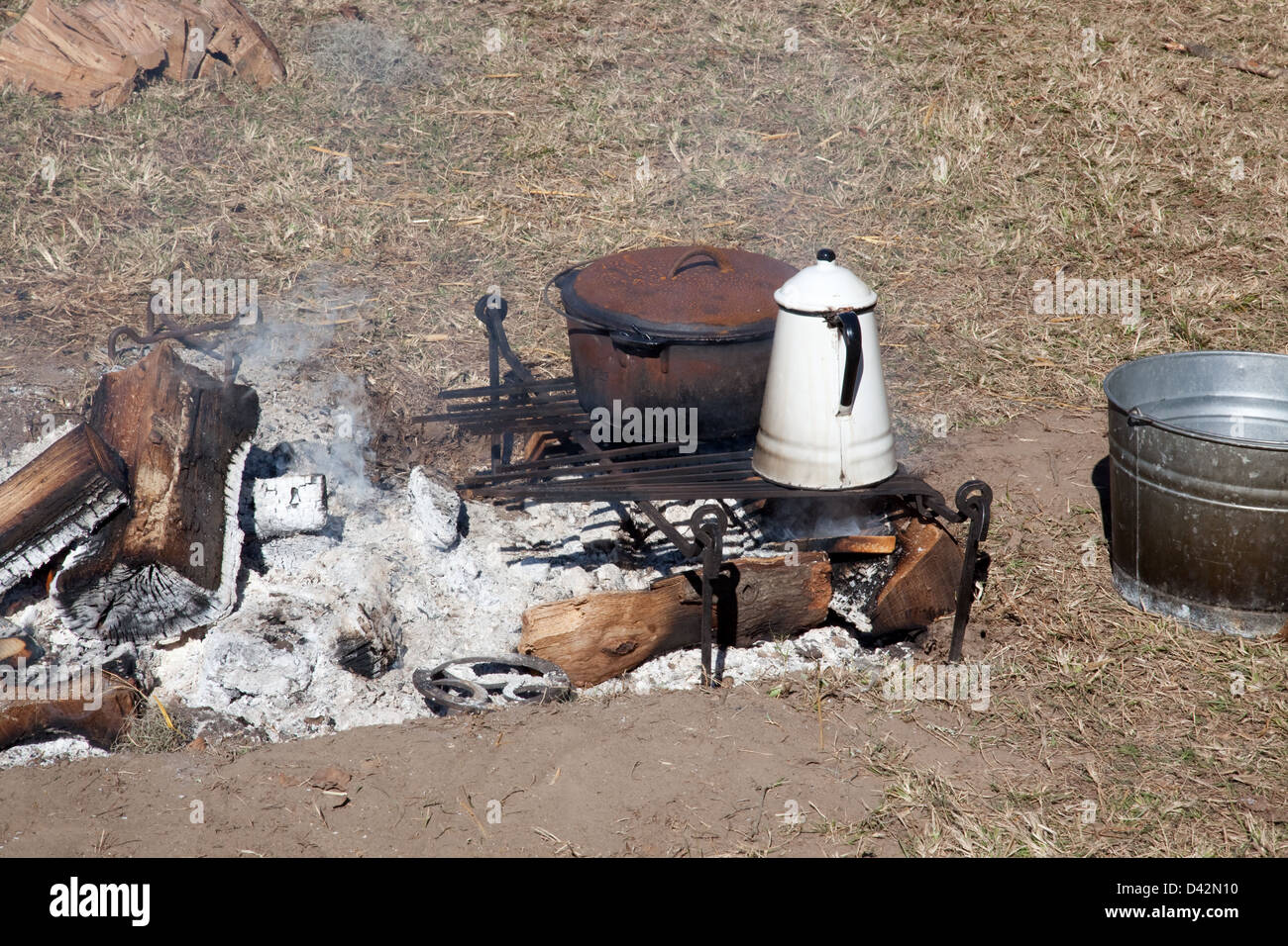 Breakfast on an open fire, with cast iron skillet and coffee pot Stock Photo