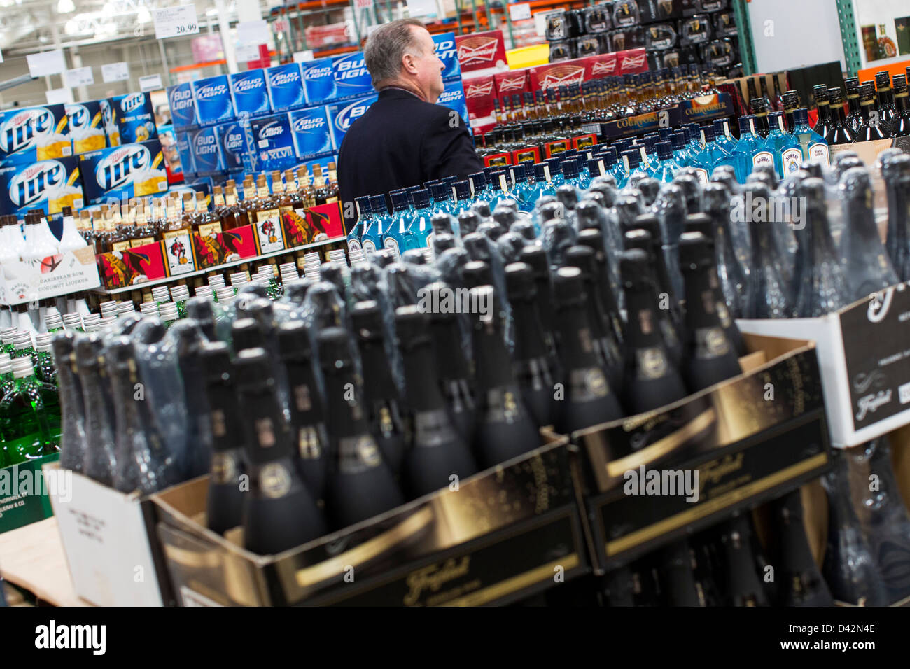 Customers shopping in the beer, wine and liquor section of a Costco