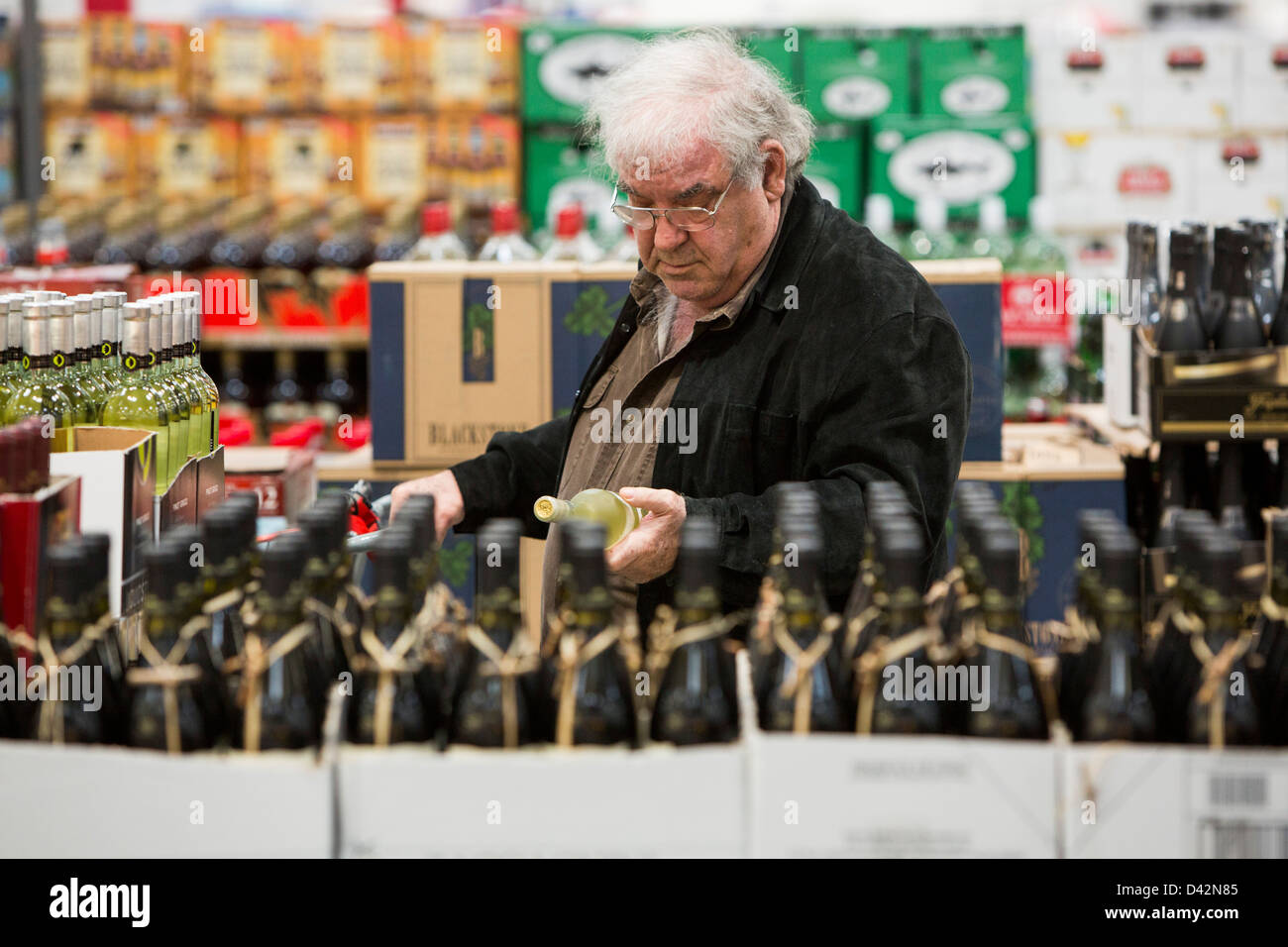 Customers shopping in the beer, wine and liquor section of a Costco