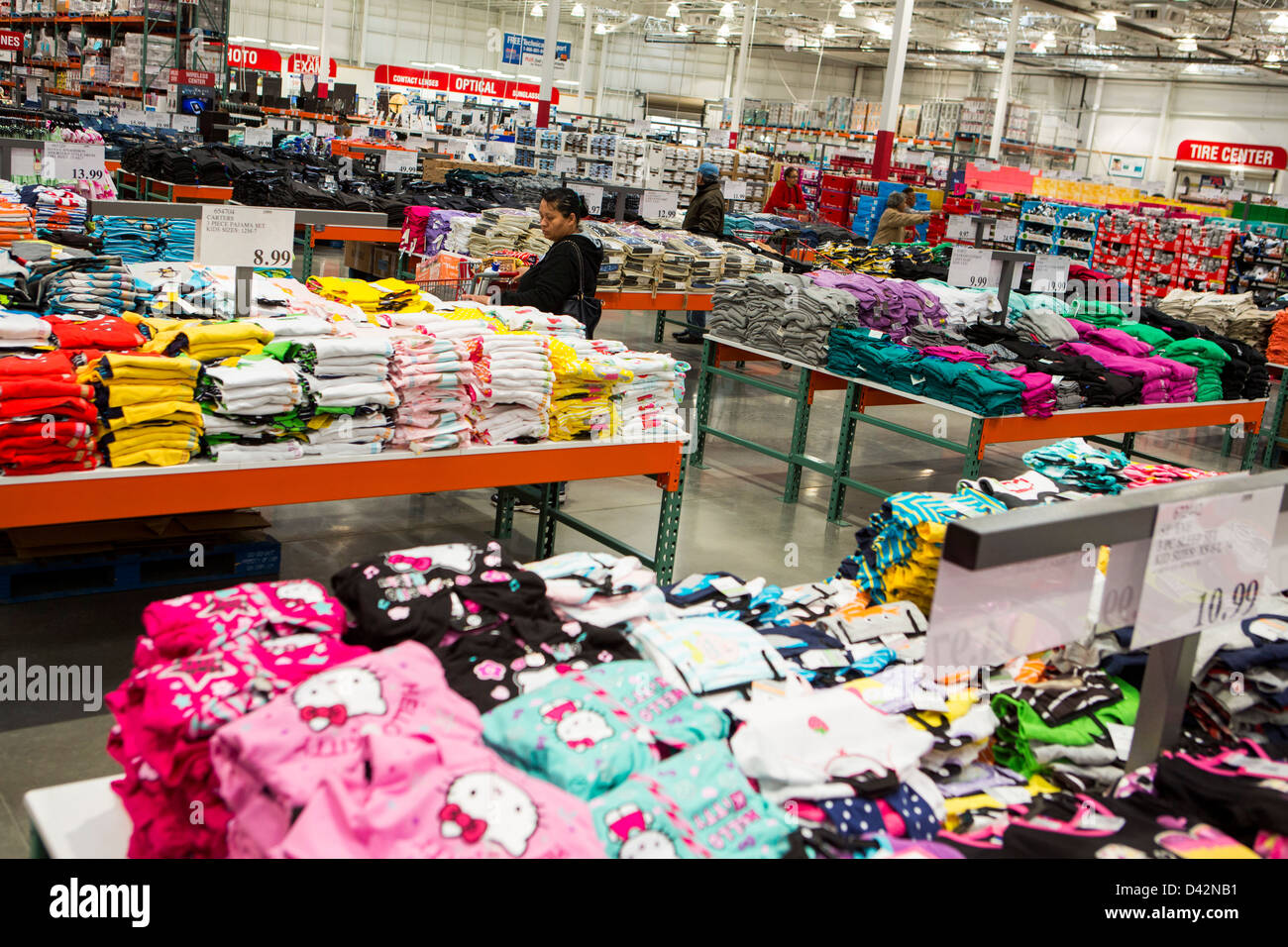 Customers shopping in the clothing section of a Costco Wholesale Warehouse Club. Stock Photo