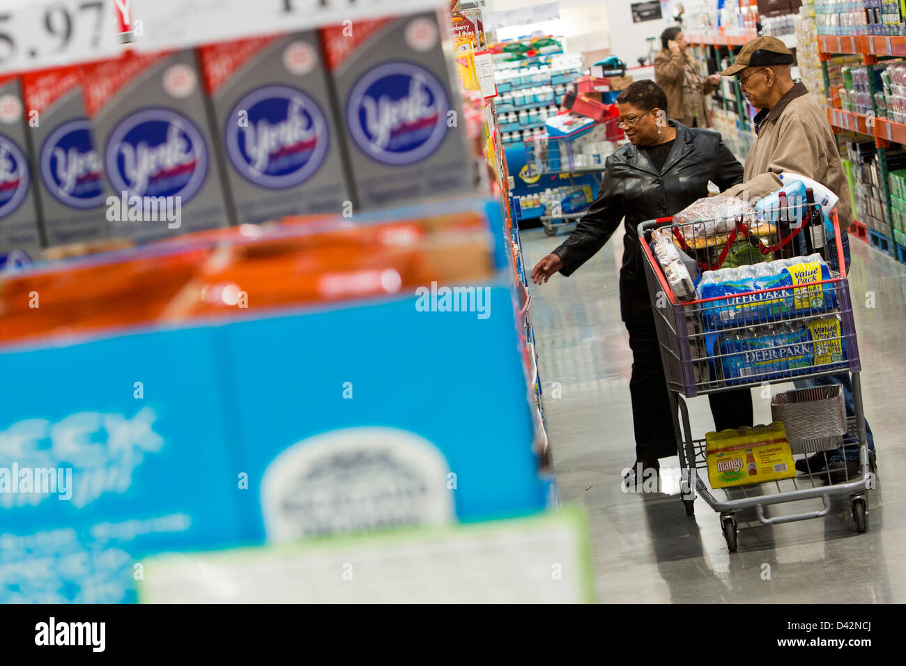 Customers shopping in the candy and snacks section of a Costco Wholesale Warehouse Club. Stock Photo