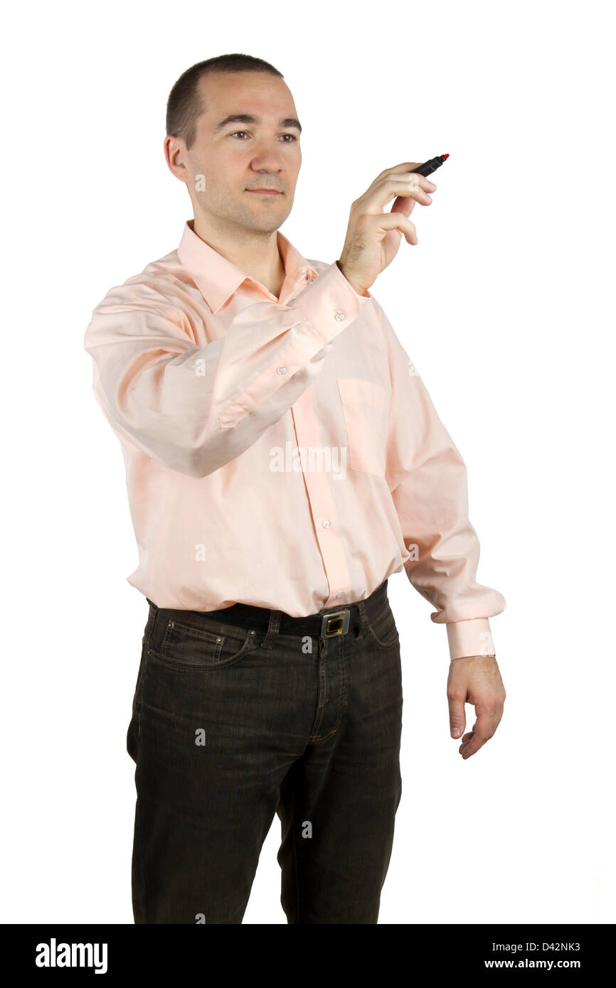 Man in casual clothes writes / draws a marker (on white background) Stock Photo