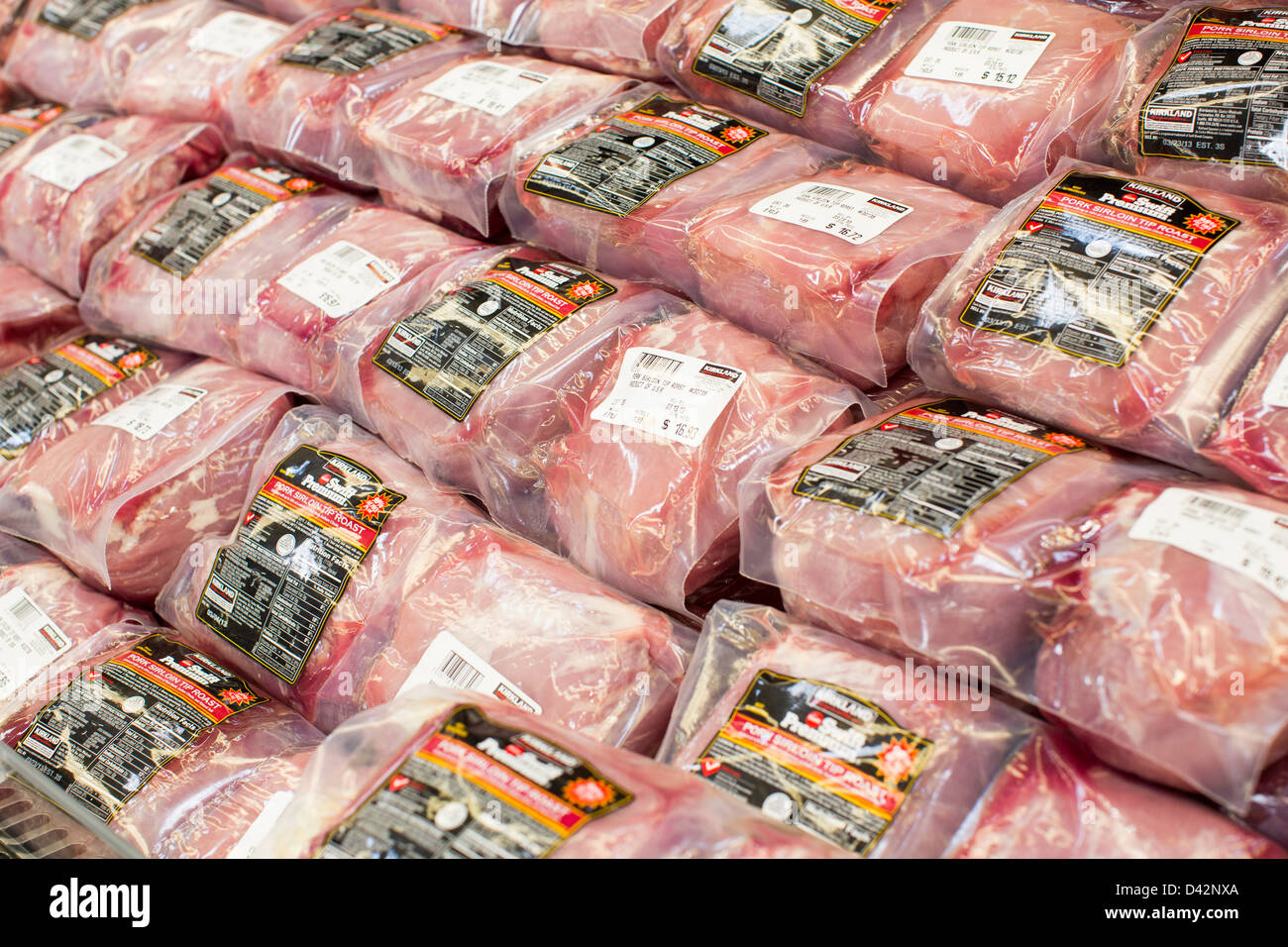 Pork shoulder roasts on display at a Costco Wholesale Warehouse Club. Stock Photo