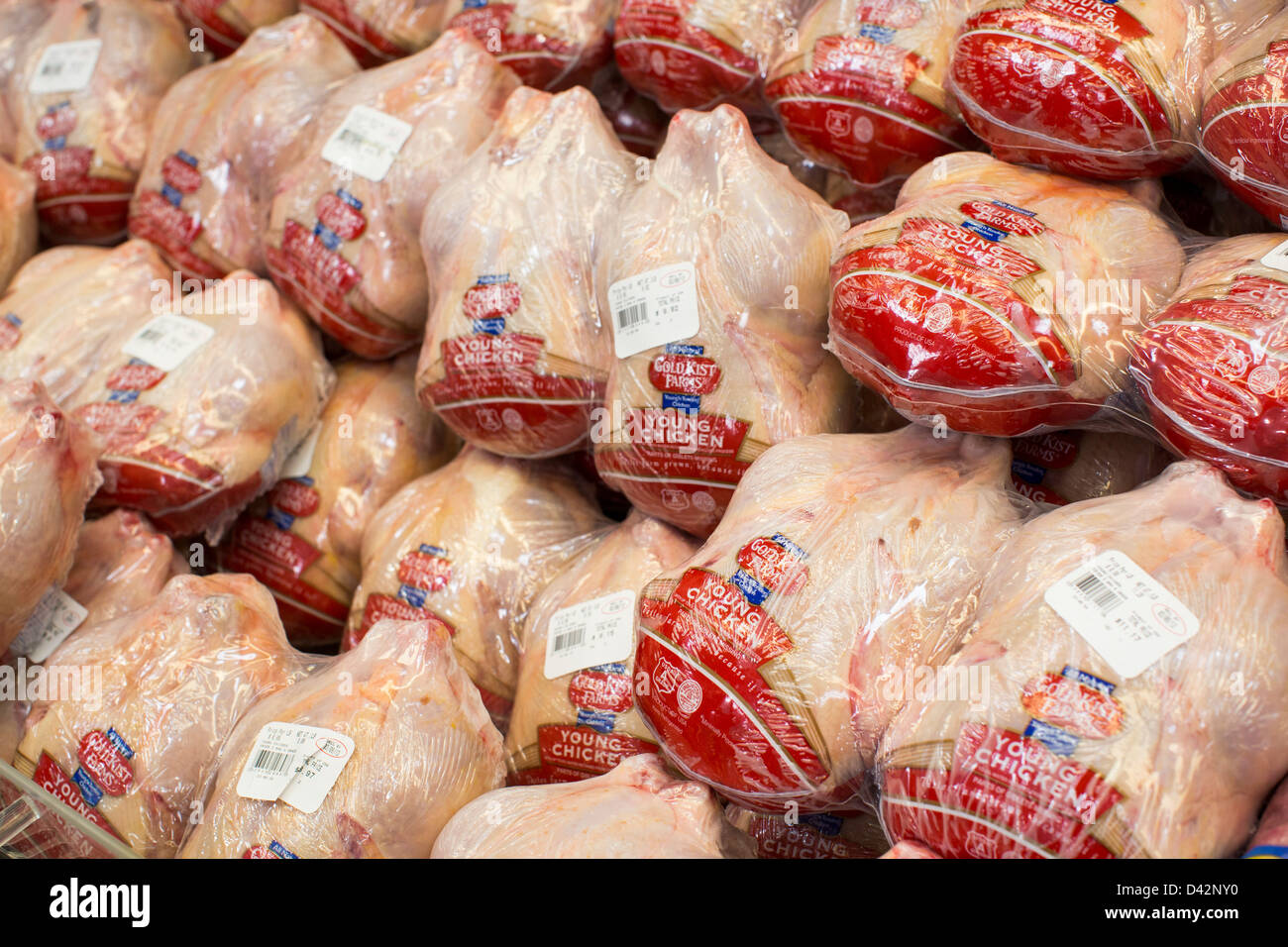 Whole chickens on display at a Costco Wholesale Warehouse Club. Stock Photo