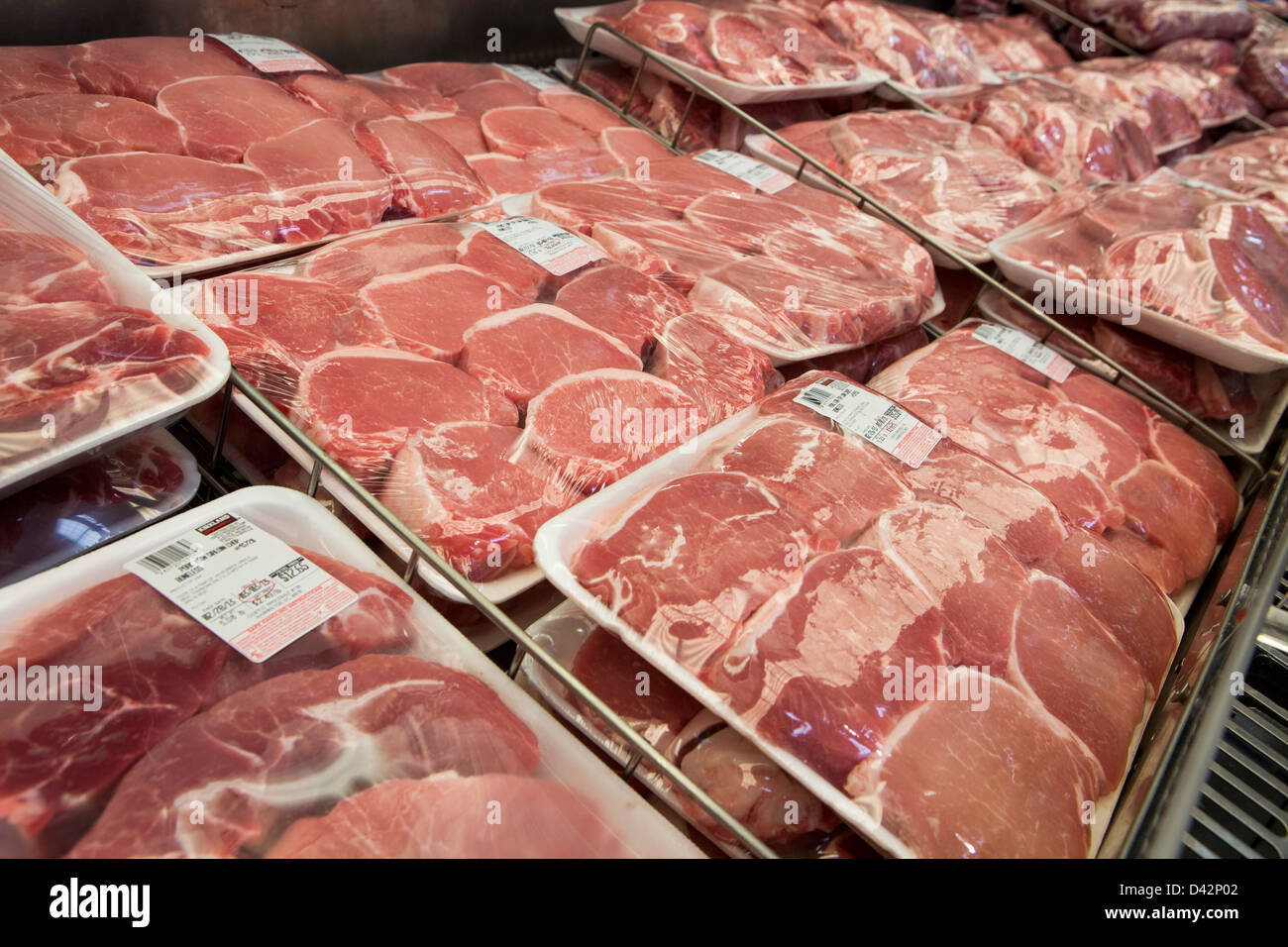 Pork products on display at a Costco Wholesale Warehouse Club. Stock Photo