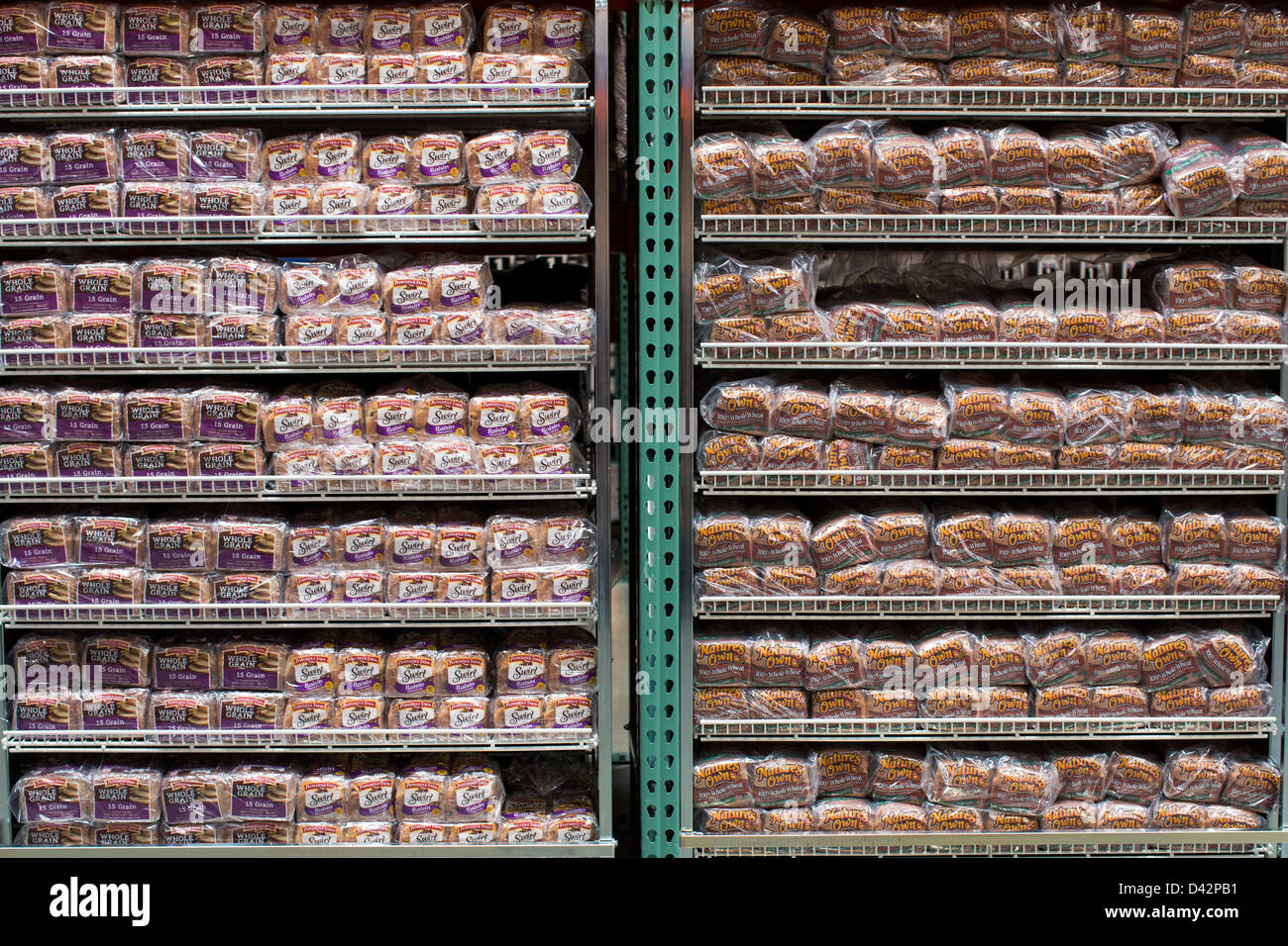 Pepperidge Farm whole grain and Nature's Own honey wheat bread on display at a Costco Wholesale Warehouse Club. Stock Photo
