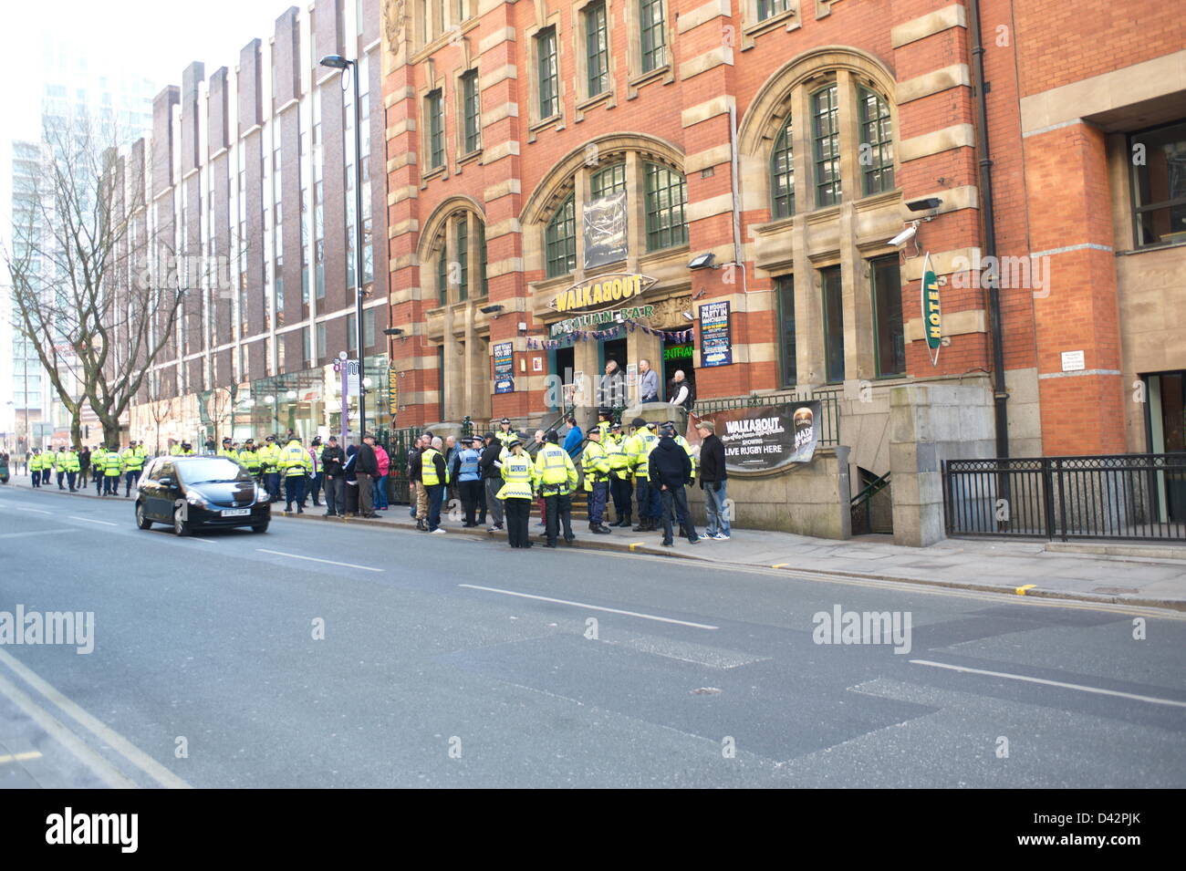 EDL drinking in a Walkabout pub on Quay Street, Manchester before the demonstration started. Demonstration passes off relatively peacefully - with a massive police operation keeping far right English Defence League (EDL) supporters and  opponents, led by Unite Against Fascism (UAF), apart as they converged on Albert Square. Manchester, England, UK. Saturday 2nd March 2013 Stock Photo