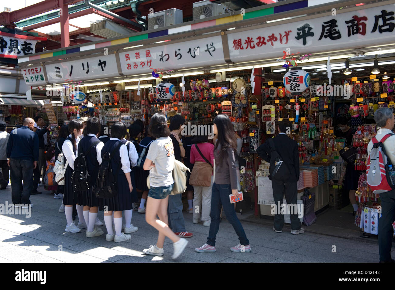 Nakamise-dori shopping street near Sensoji Temple is lined with tourist shops and crowded with sightseers, in Asakusa, Tokyo Stock Photo