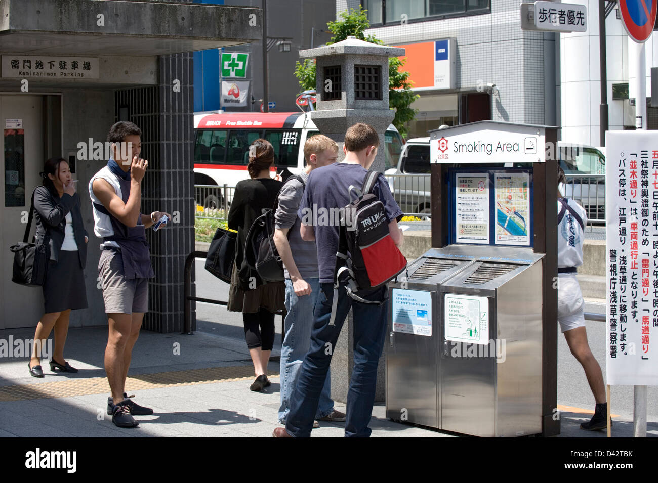 Many public outdoor spaces around Tokyo are off limits to smokers except at specially designated smoking areas. Stock Photo