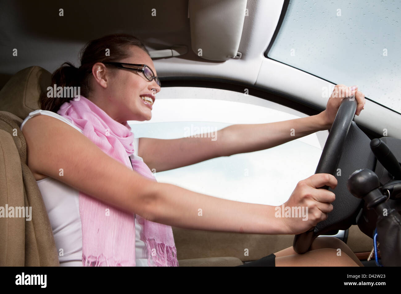 Freiburg, Germany, a young woman driving a car Stock Photo