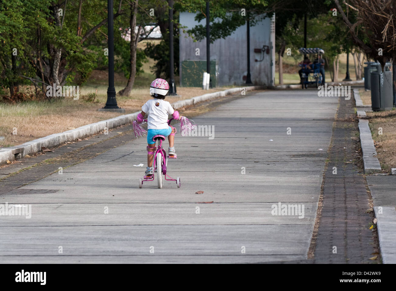 learning to ride the bicycle at sunny day Stock Photo