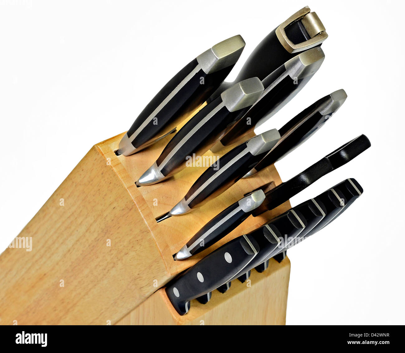 A set of kitchen knives in a wooden block. Stock Photo