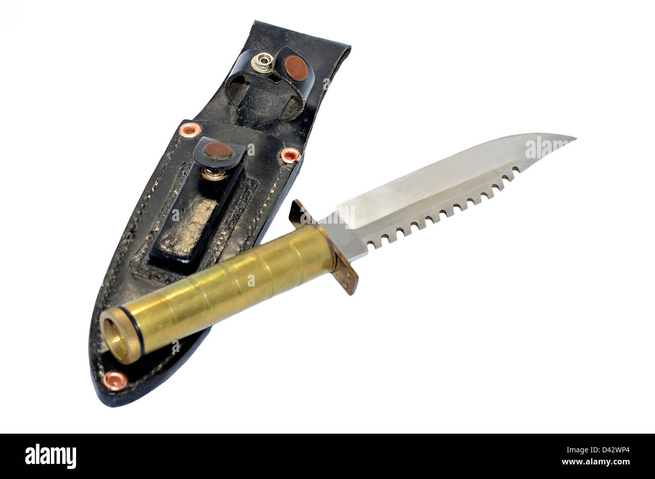 An old wilderness survival knife with brass handle along with a case and whet stone. Stock Photo