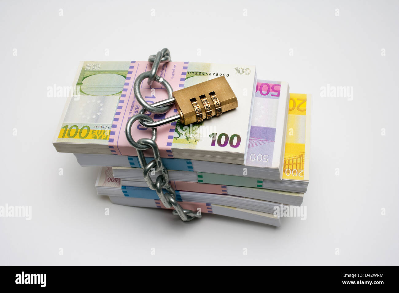 Freiburg, Germany, money stack with euro notes and a chain with a lock so Stock Photo