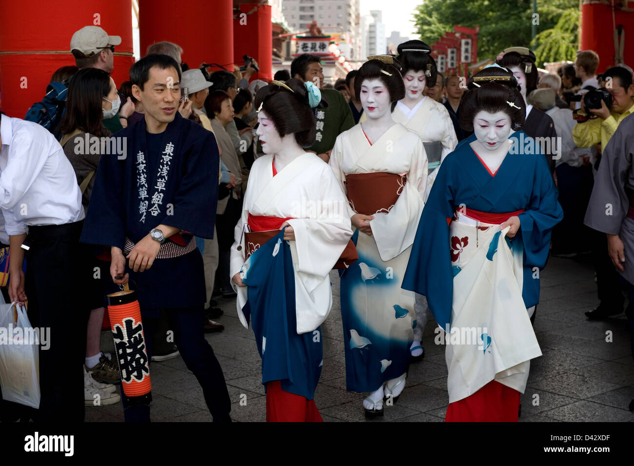 A procession of fake geisha women is part of the festivities at the Sanja Matsuri Festival at Sensoji Temple in Asakusa, Tokyo. Stock Photo
