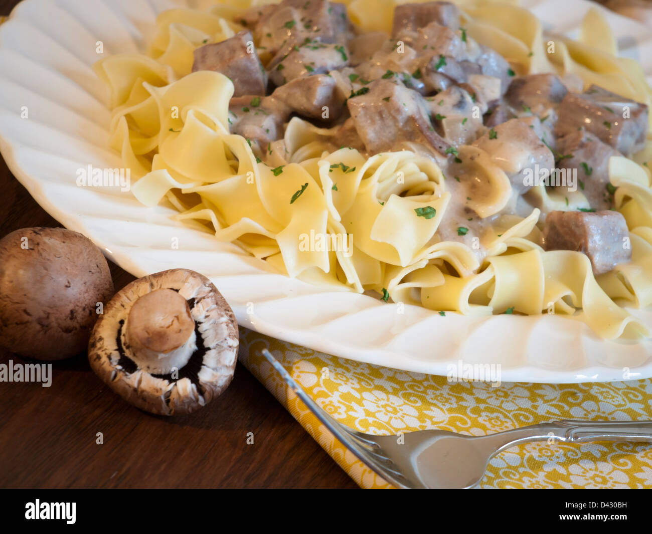 Beef stroganoff on egg noodles Stock Photo - Alamy