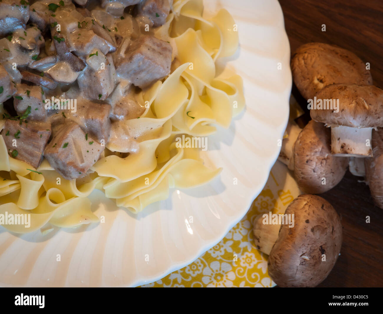 Beef stroganoff on egg noodles Stock Photo - Alamy