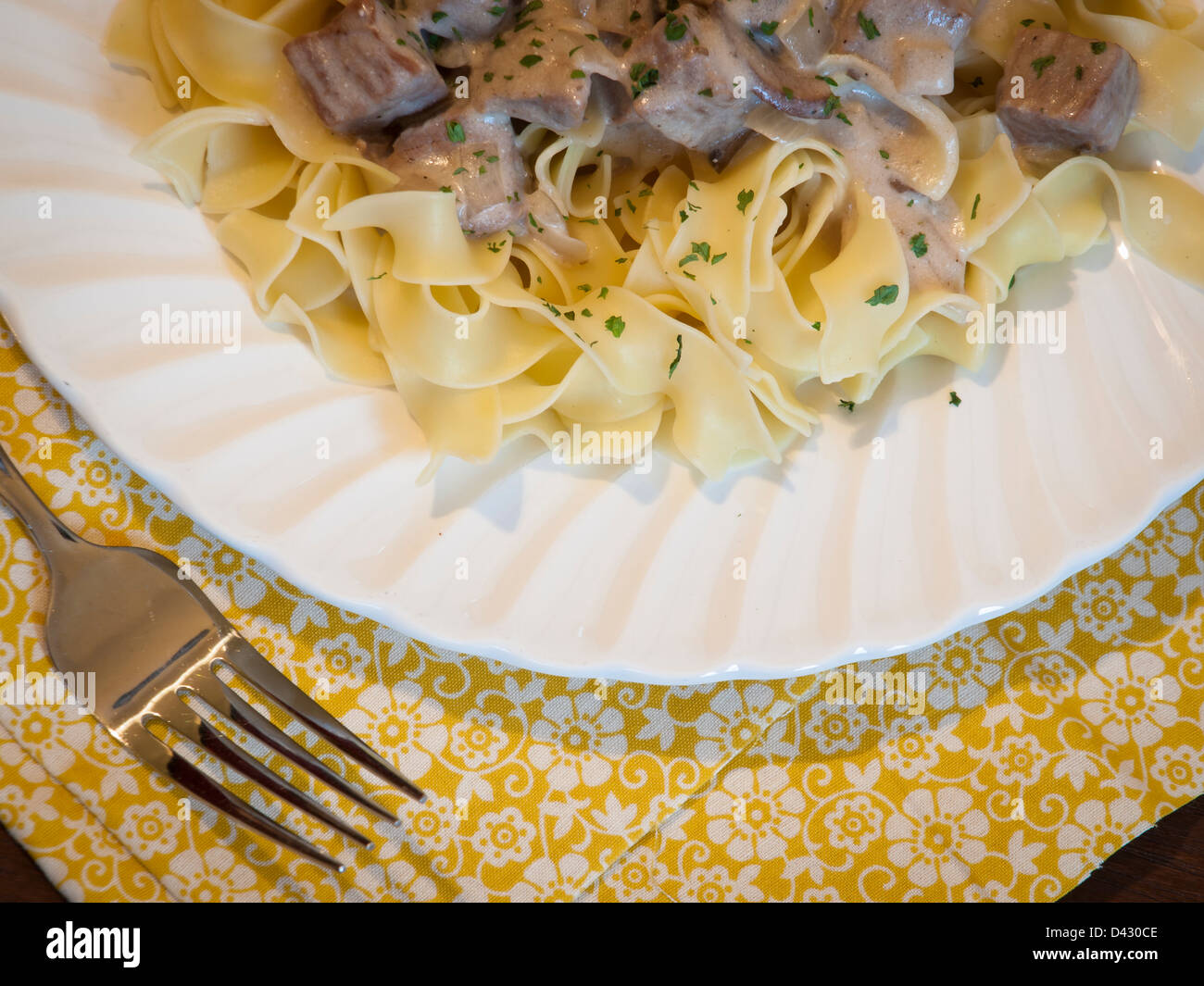 Beef stroganoff on egg noodles Stock Photo - Alamy