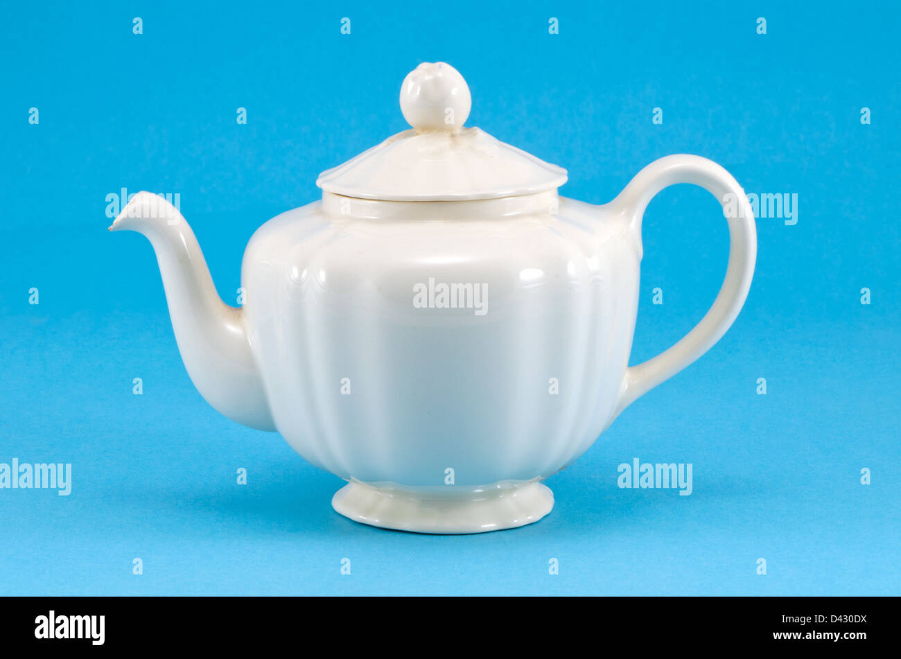 retro ceramic white teapot dish on blue background Stock Photo Alamy