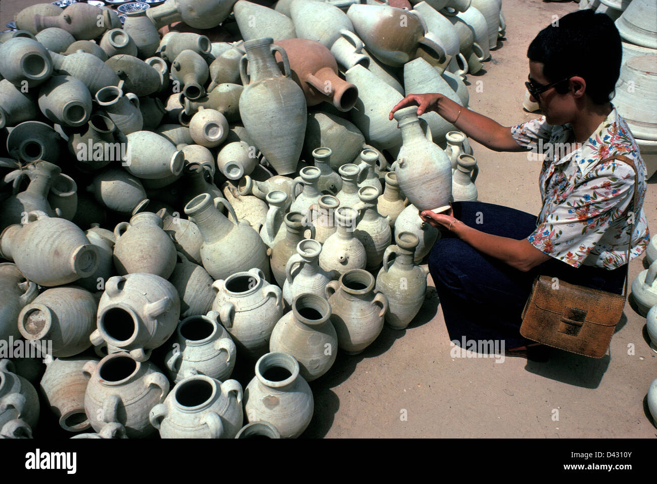 Tourist buying pottery  in Tunisia Stock Photo