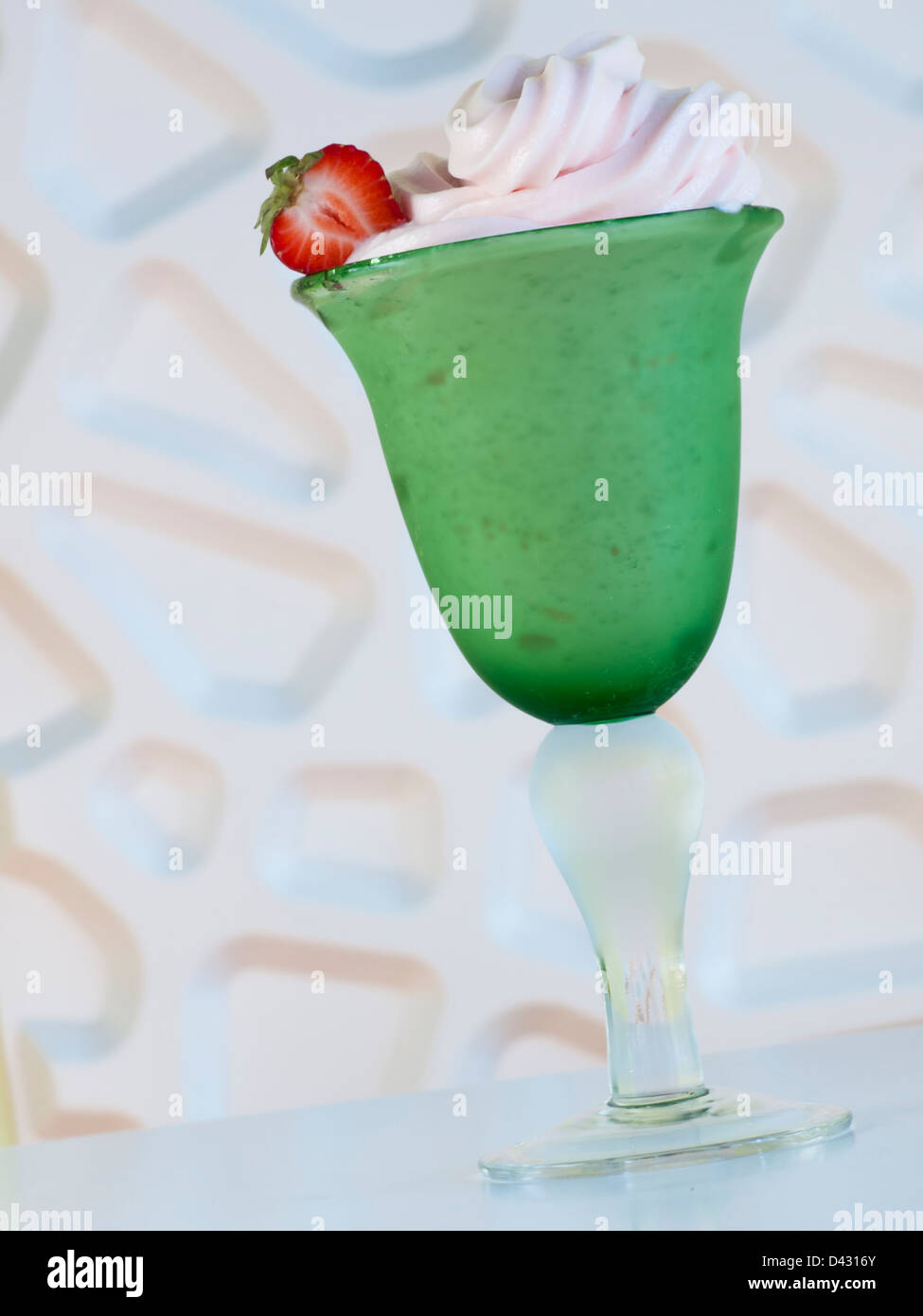 Cup of strawberry frozen yogurt or soft serve ice cream with fresh