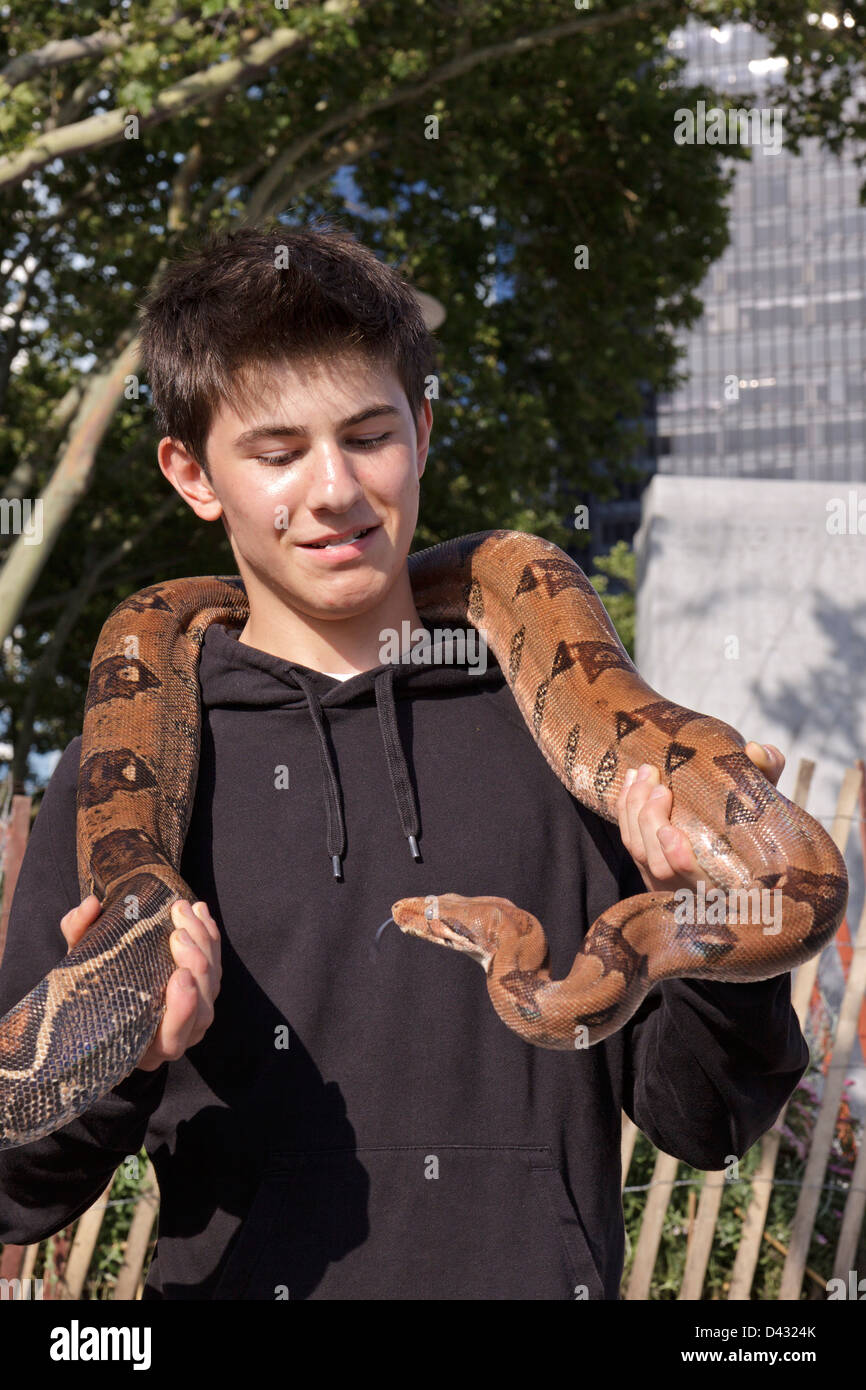 boy with snake, Lower Manhattan, New York City, USA Stock Photo