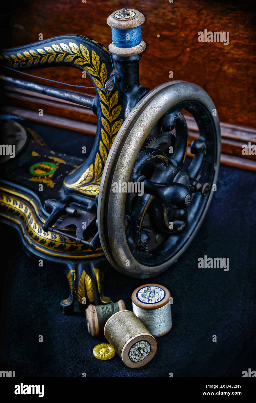 A vintage sewing machine and thread Stock Photo