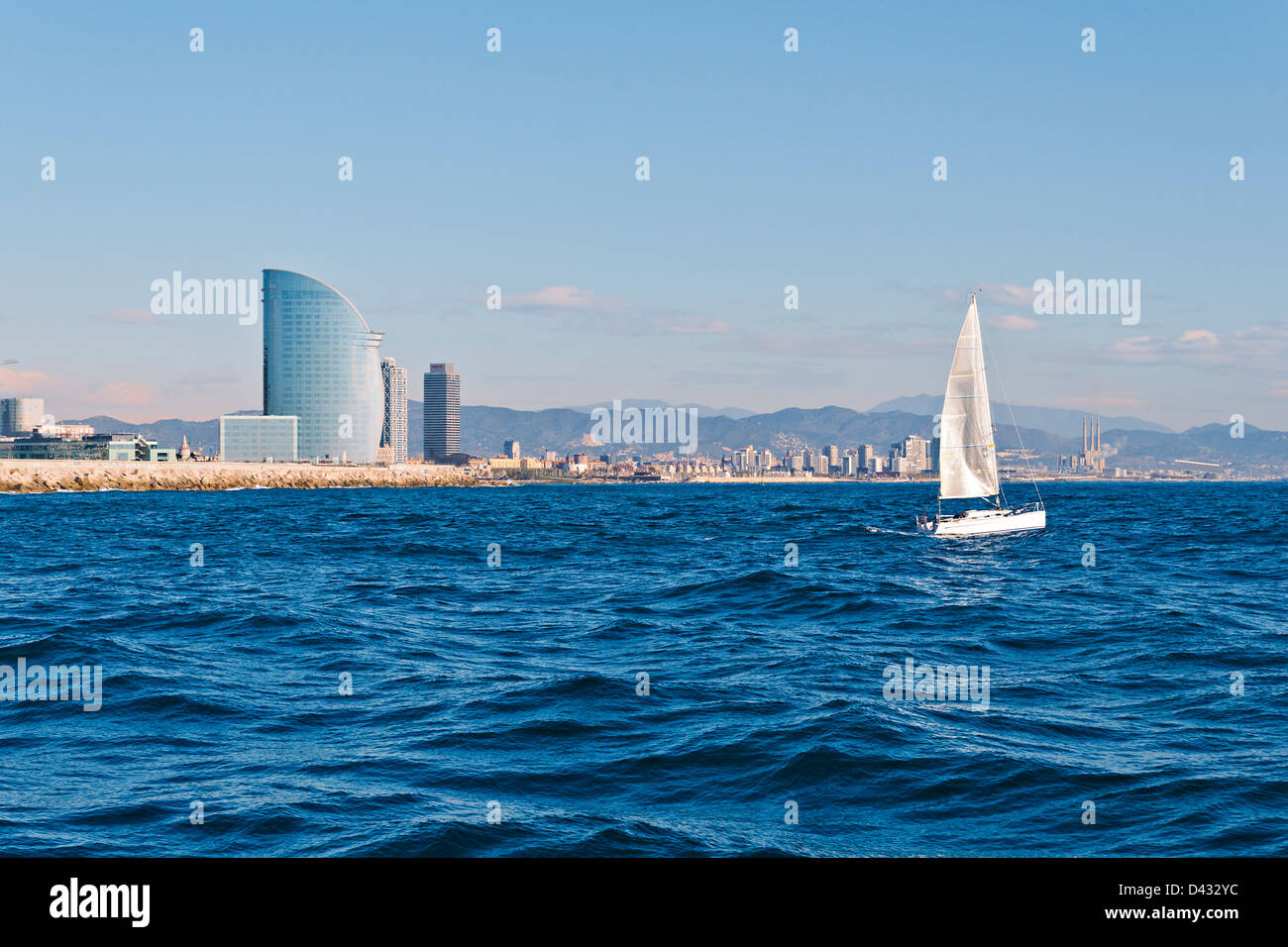 Sailing in Barcelona with the city in the background Stock Photo