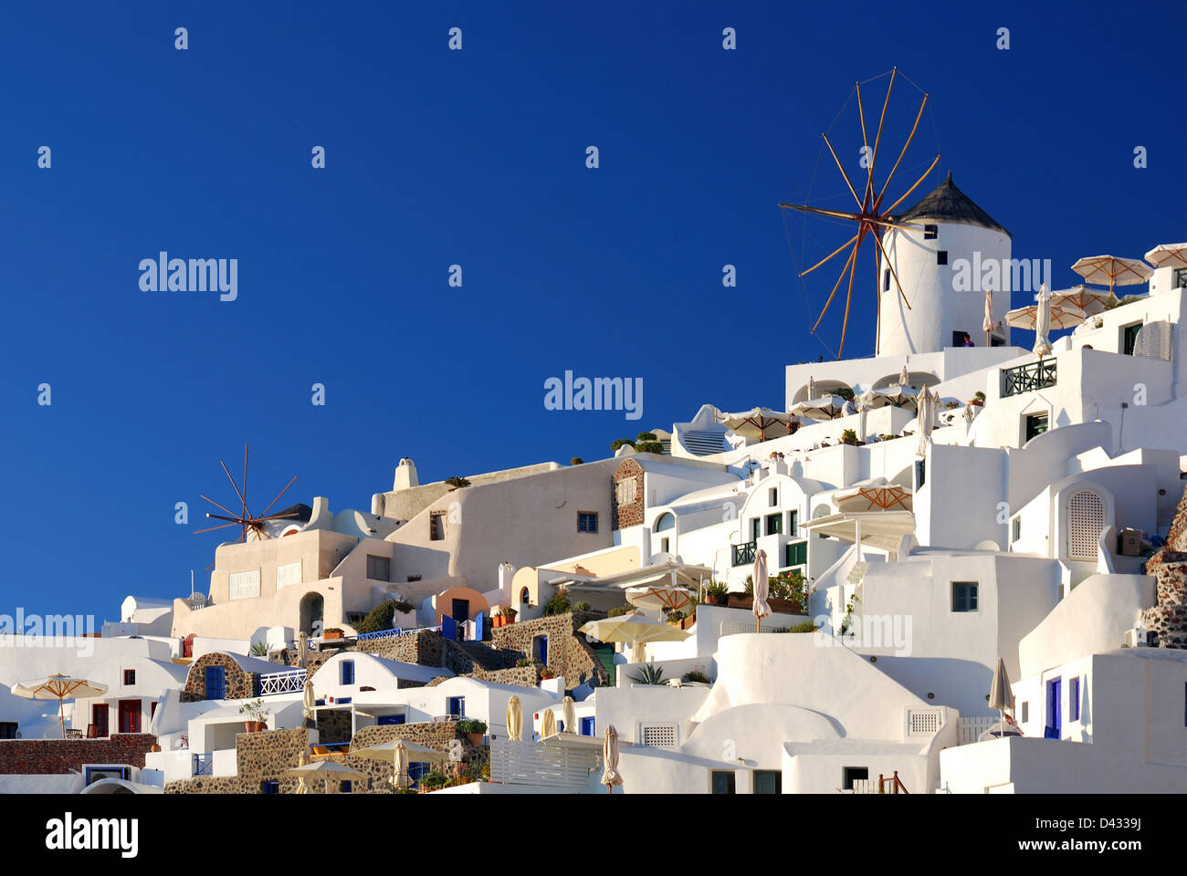 Windmill in Santorini. Oia is a community on the islands of Thira (Santorini) and Therasia, in the Cyclades, Greece. Stock Photo