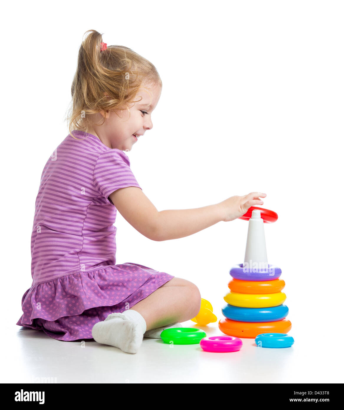 little child playing with colorful toys, isolated over white Stock ...