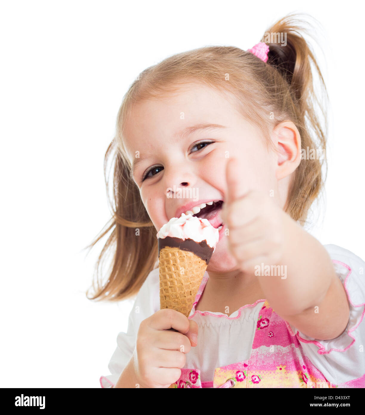 happy kid girl eating ice cream and showing thumb up Stock Photo - Alamy