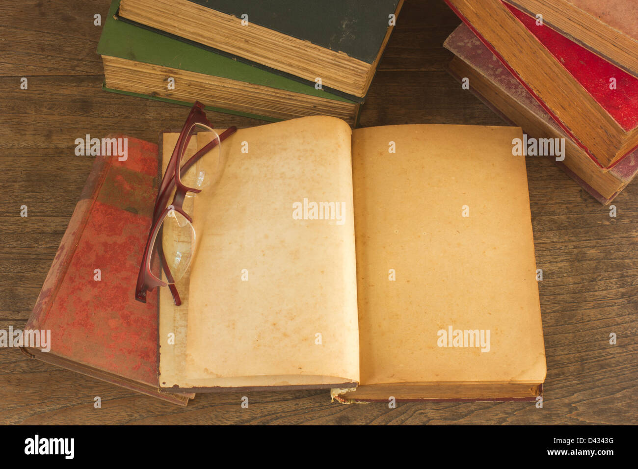 Old opened book with blank pages on wooden background. Stock Photo