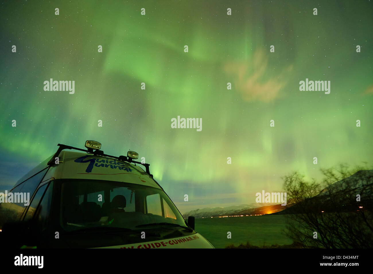 guided tour aurora hunter minibus under northern lights aurora borealis near tromso in northern norway europe Stock Photo