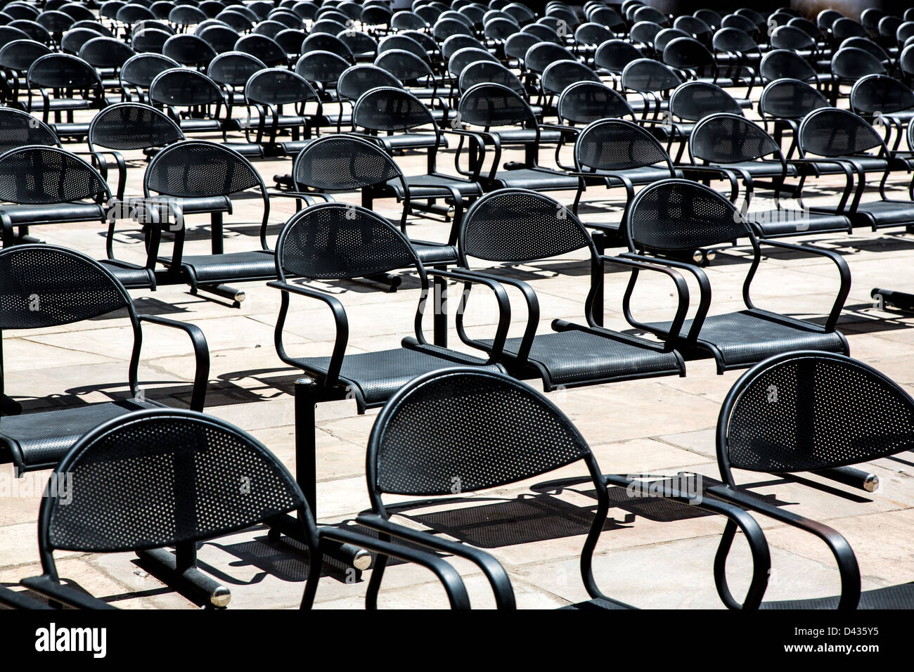 empty chairs standing in a row Stock Photo