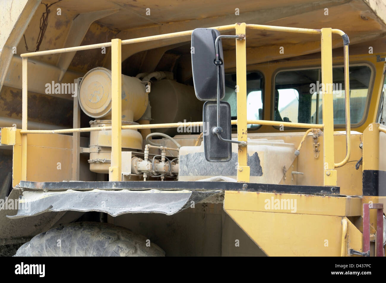 cabin of a yellow rundown dump truck Stock Photo