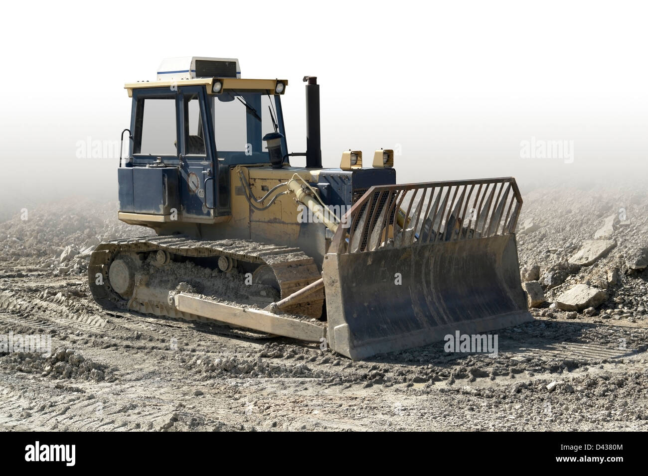 old caterpillar in building lot, gradient isolated Stock Photo