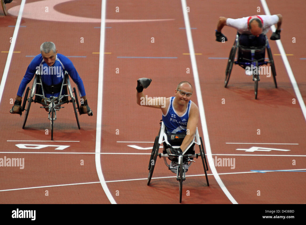 Toni Piispanen of Finland wins gold in the mens 100m - T51 in the Olympic stadium at the London 2012 Paralympic games. Stock Photo