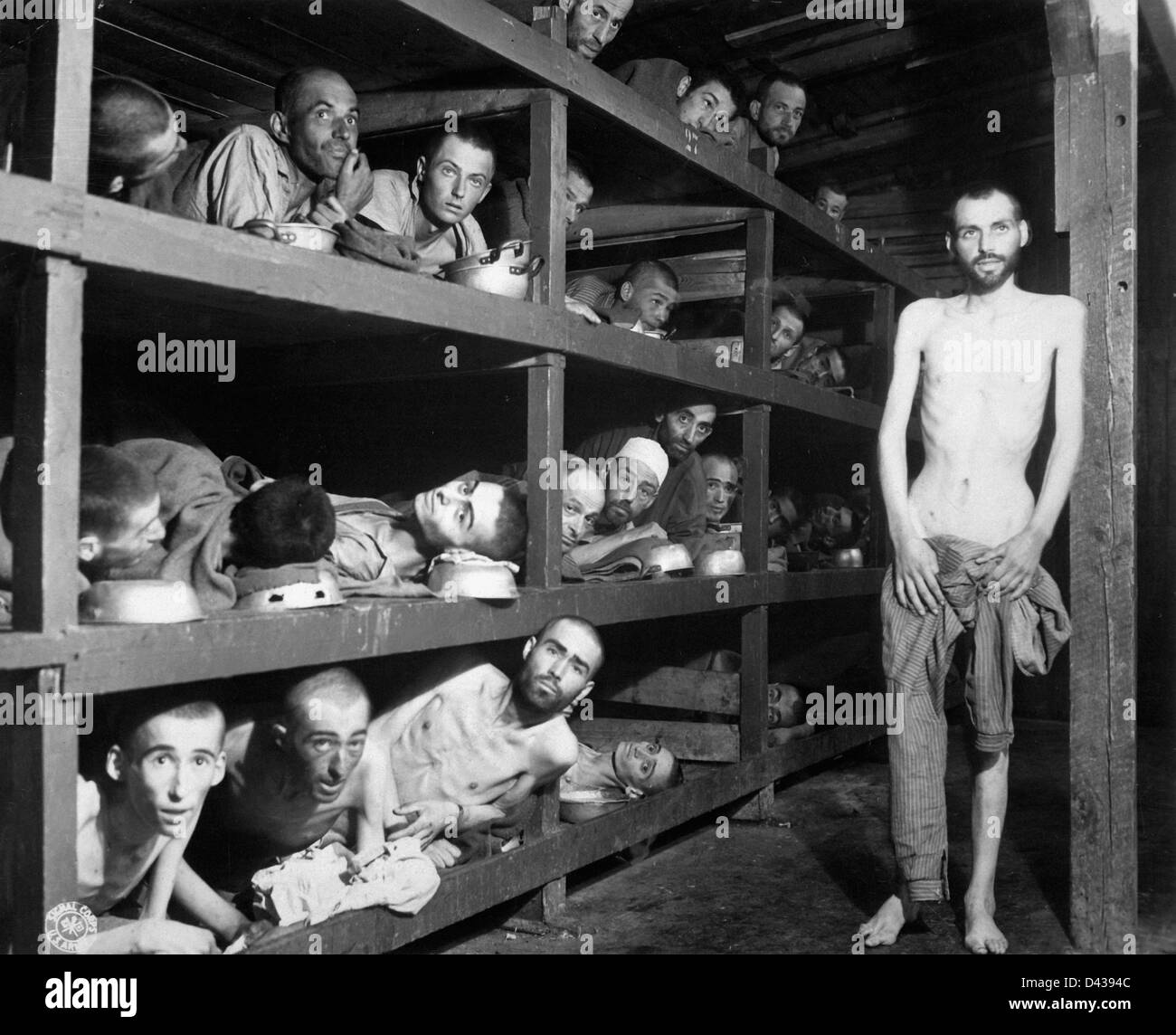 Jewish slave laborers stacked in their bunks at the Buchenwald Concentration Camp after liberation by the US Army 80th Division April 16, 1945 in Jena, Germany. Stock Photo